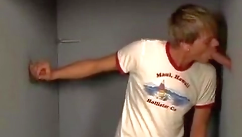 Sexy blonde model is in a stripper room